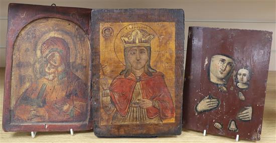 Three Russian painted wood icons largest 27cm